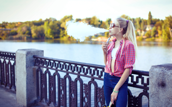 Young woman vaping